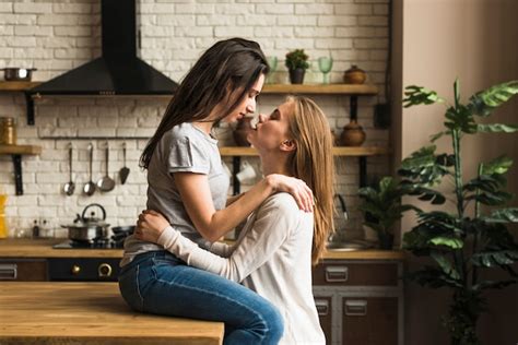 hot lesbians|two attractive lesbian girlfriends passionately kissing and。